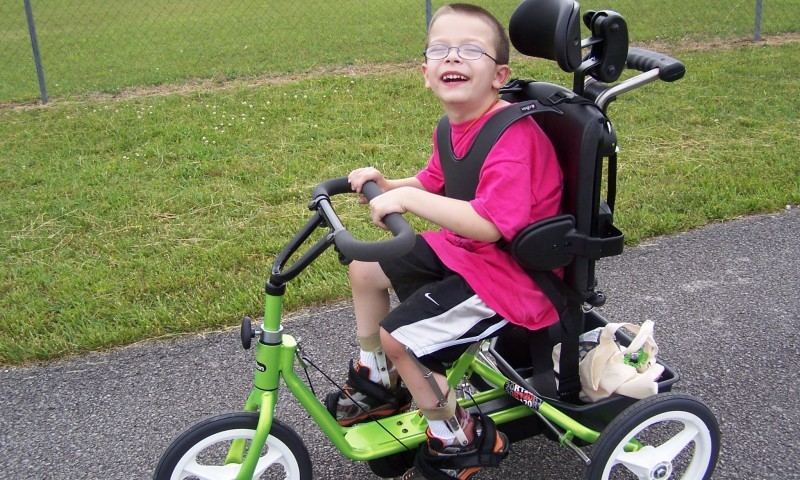 From the winner of a Parent:  Judd, received his Rifton tricycle that he won through your bike giveaway. He loves it so much. His first time out with it , he pedaled .75 miles! Everyone at the track had a smile on their faces watching him enjoy his bike. The biggest smile there belonged to him though.