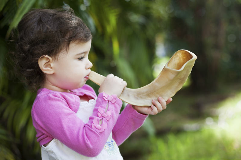 Girl Blowing Shofar