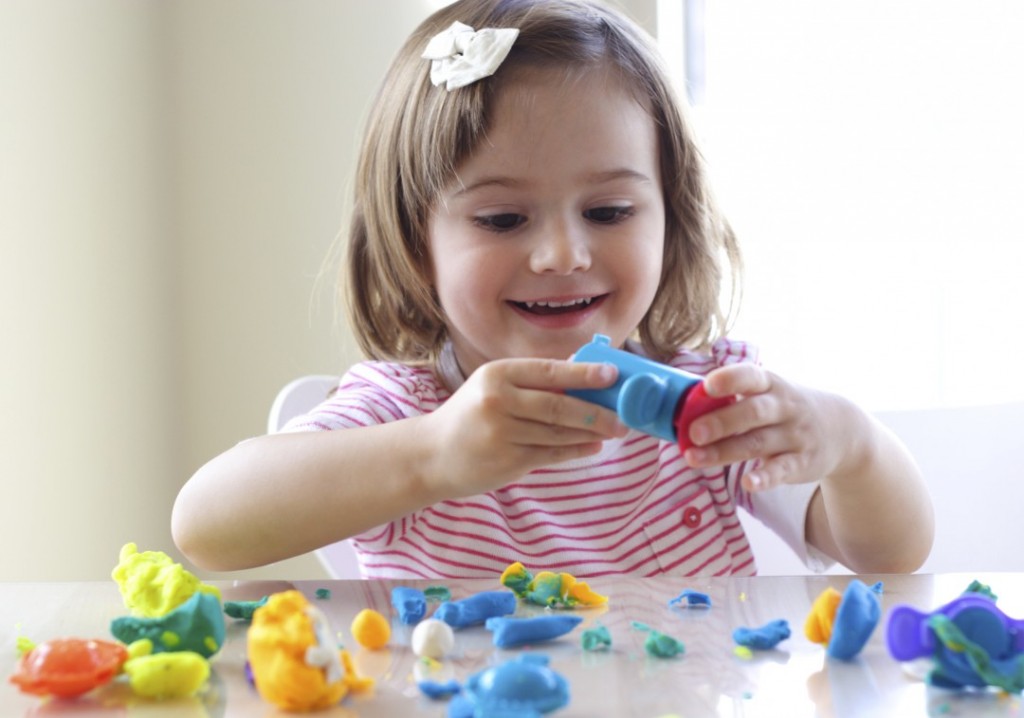 Girl playing with play dough