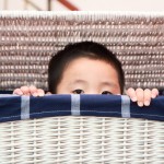 Boy Hiding in Laundry Basket