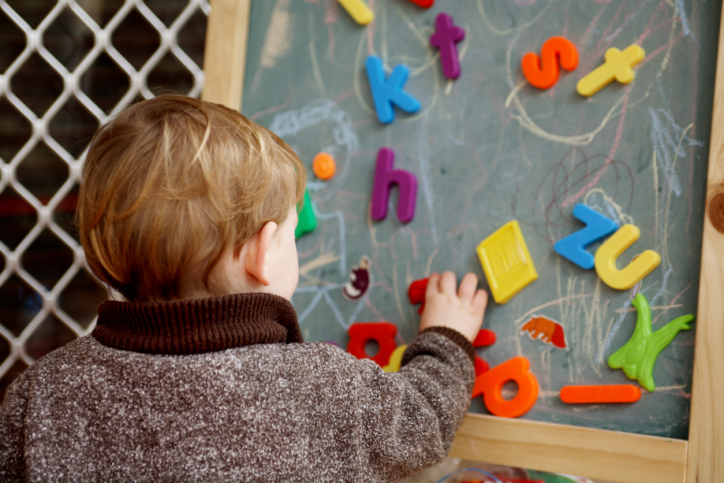 Boy Playing with letters
